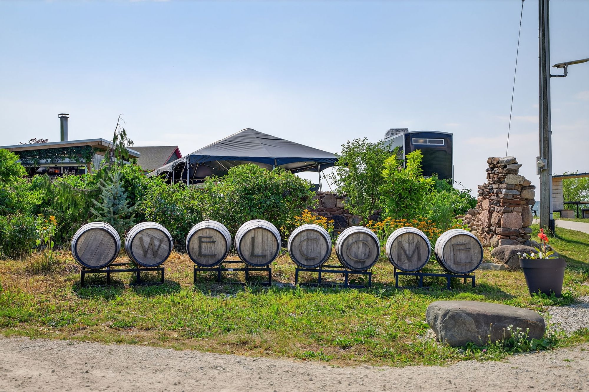 Welcome spelled out on barrel ends at the drive